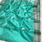 Aqua Turquoise handloom Pattu Silk Chanderi saree with silver floral buttas and deep green leaf accents