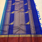 Turquoise blue Kanjipuram Rettapet silk saree folded, showing brick-red border