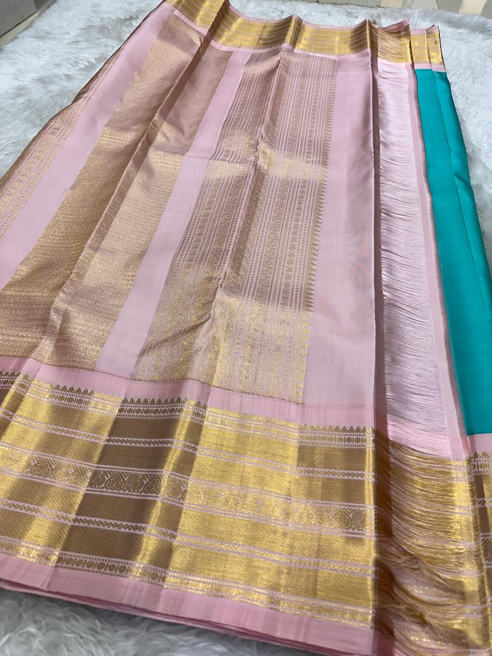 kv pallu detail of turquoise blue Kanchipuram silk saree