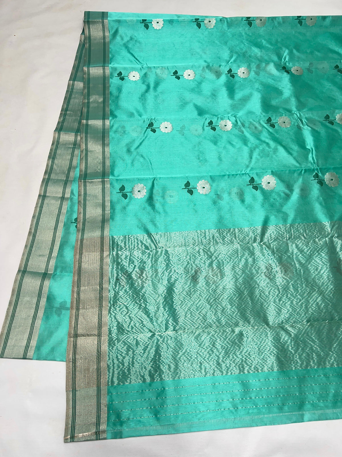Aqua Turquoise Chanderi saree border detail with silver banding and fine deep green lines