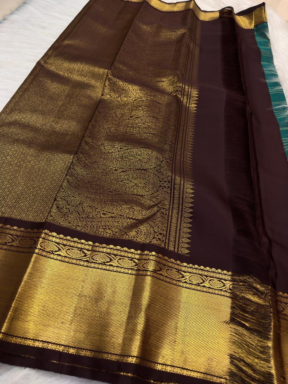 Twin Yazhi gold zari motifs on teal green Pure Silk Kanchipuram body