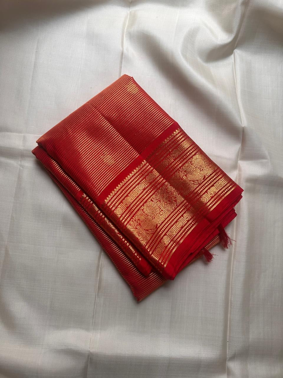 gold border detail of deep red Kanchipuram silk saree