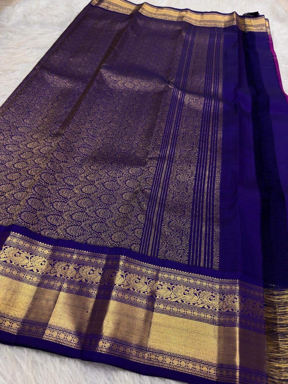 Vadamalli Magenta-Purple Kanchipuram body scattered with traditional gold zari buttas.