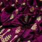 Draped purple handloom Chanderi silk saree with green magenta woven accents and gold-toned border