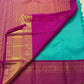 Jewel-toned magenta-pink and teal pure silk Kanchipuram saree with luminous gold zari