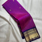 Vadamalli Magenta-Purple Pure Silk Kanchipuram Butta saree with traditional gold zari buttas.