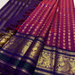 Vadamalli magenta Pure Silk Kanjivaram saree draped, showing zari-woven Gandaberunda motifs