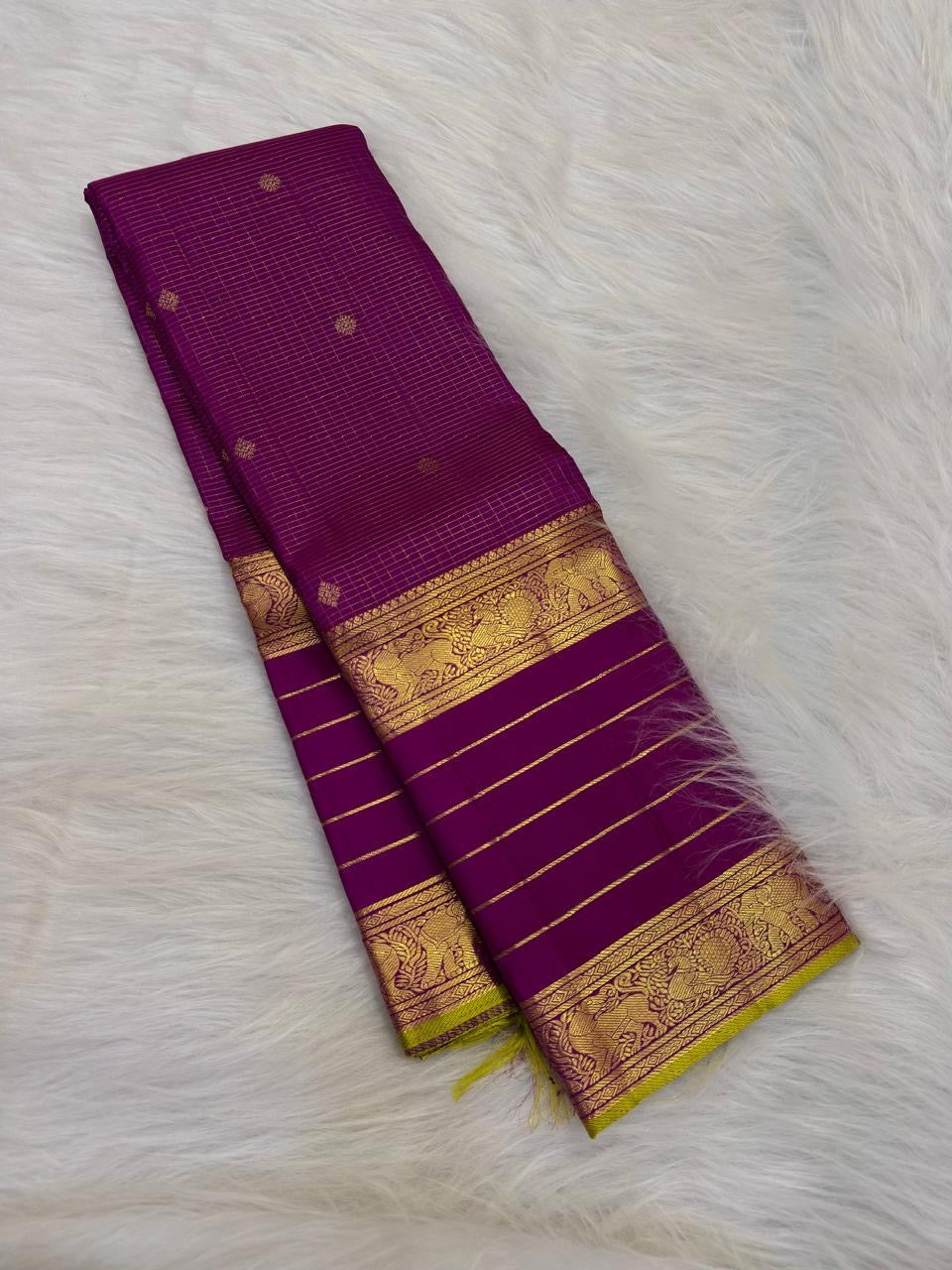 Close view of antique-gold traditional zari motifs on Vadamalli Purple Kanjivaram silk.
