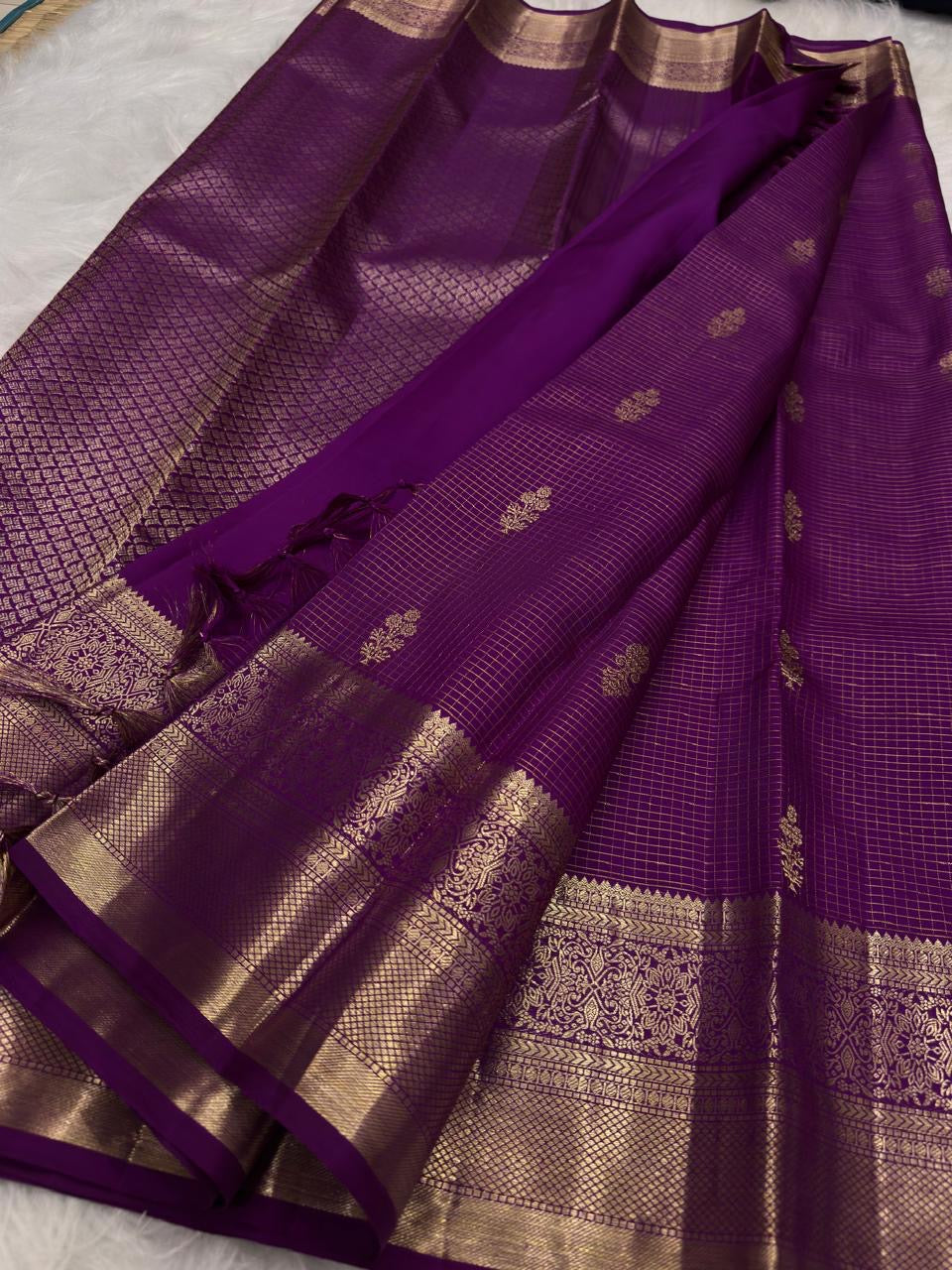 Broad antique-gold woven border on Vadamalli Purple Kanjivaram saree.