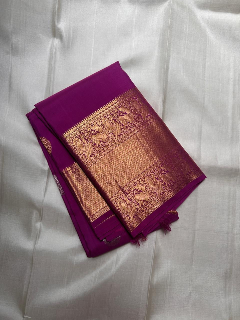 Vadamalli purple Kanchipuram silk saree with peacock butta zari weave