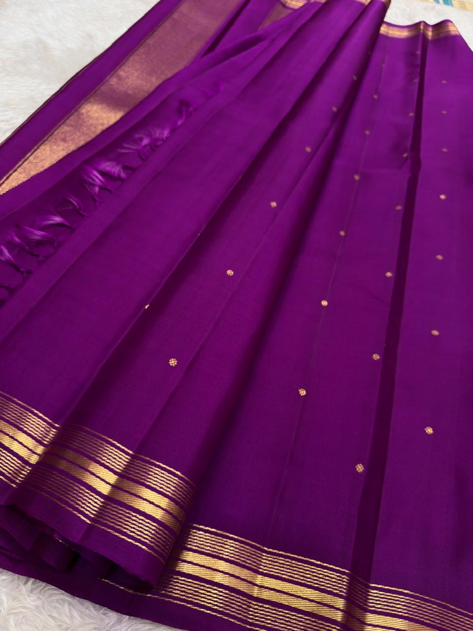 Vadamalli purple pallu woven with broad vertical classic-gold zari panels.