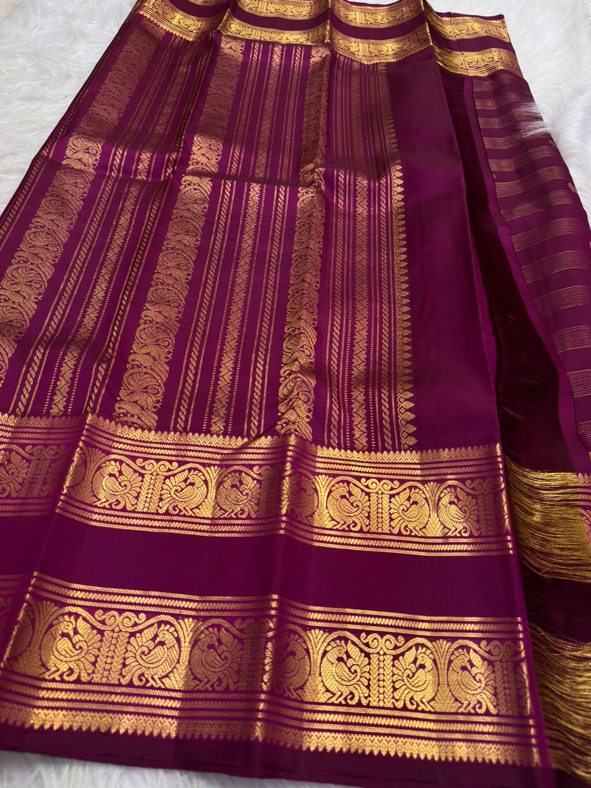 Deep purple Pure Silk Kanjivaram with spaced zari buttas and repeated gold zari lines
