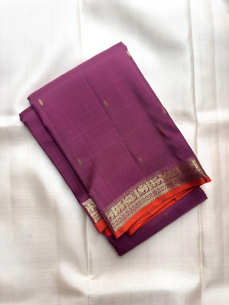 Vadamalli Purple pure silk Kanchipuram saree with antique-gold woven detailing.
