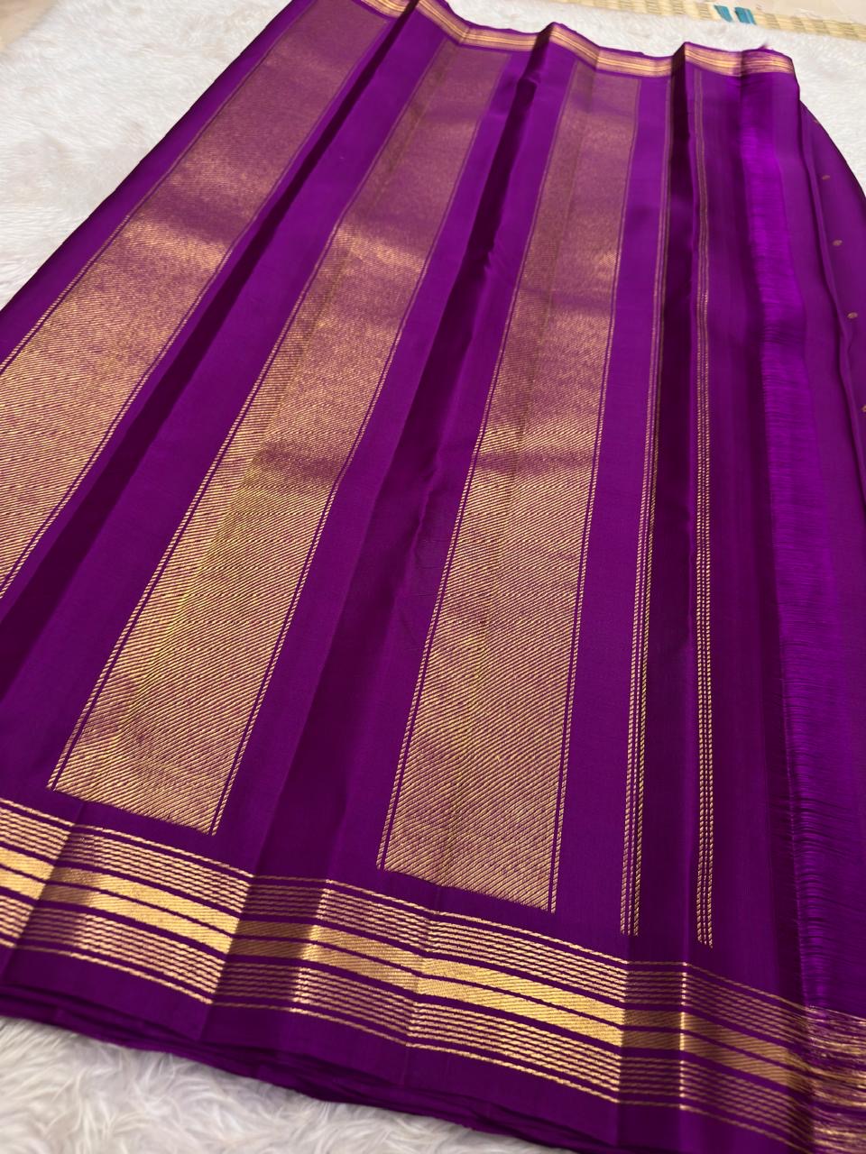 Vadamalli purple Pure Silk Kanjivaram saree with small gold zari buttas and a refined linear gold zari border.