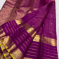 Magenta purple Kanchipuram silk saree with fine gold checks and spaced zari motifs.
