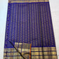 Close body view of evenly spaced gold zari buttas over fine Vairaoosi linear weaving