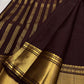 Deep cinnamon brown Vanasringaram Butta Kanchipuram silk saree, folded view showing body and border