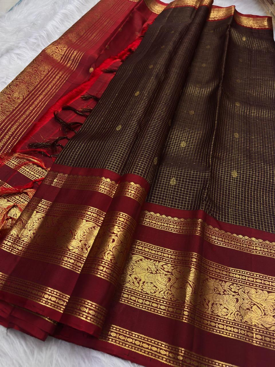 Deep Coffee Brown Zari Kattam silk showing fine gold checks and elaborate Arakku Red Vanasringaram border.