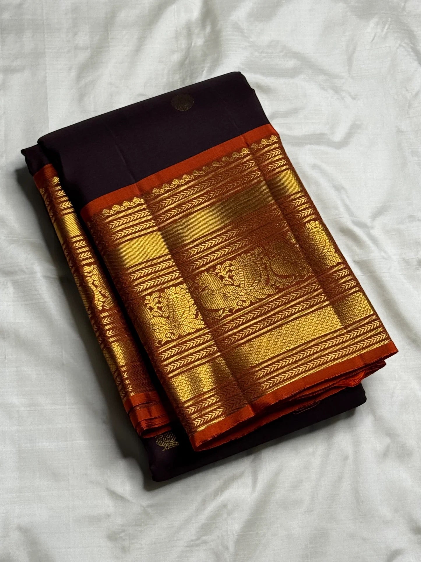Traditional Kanchi Pattu saree with peacock-inspired chakram motifs