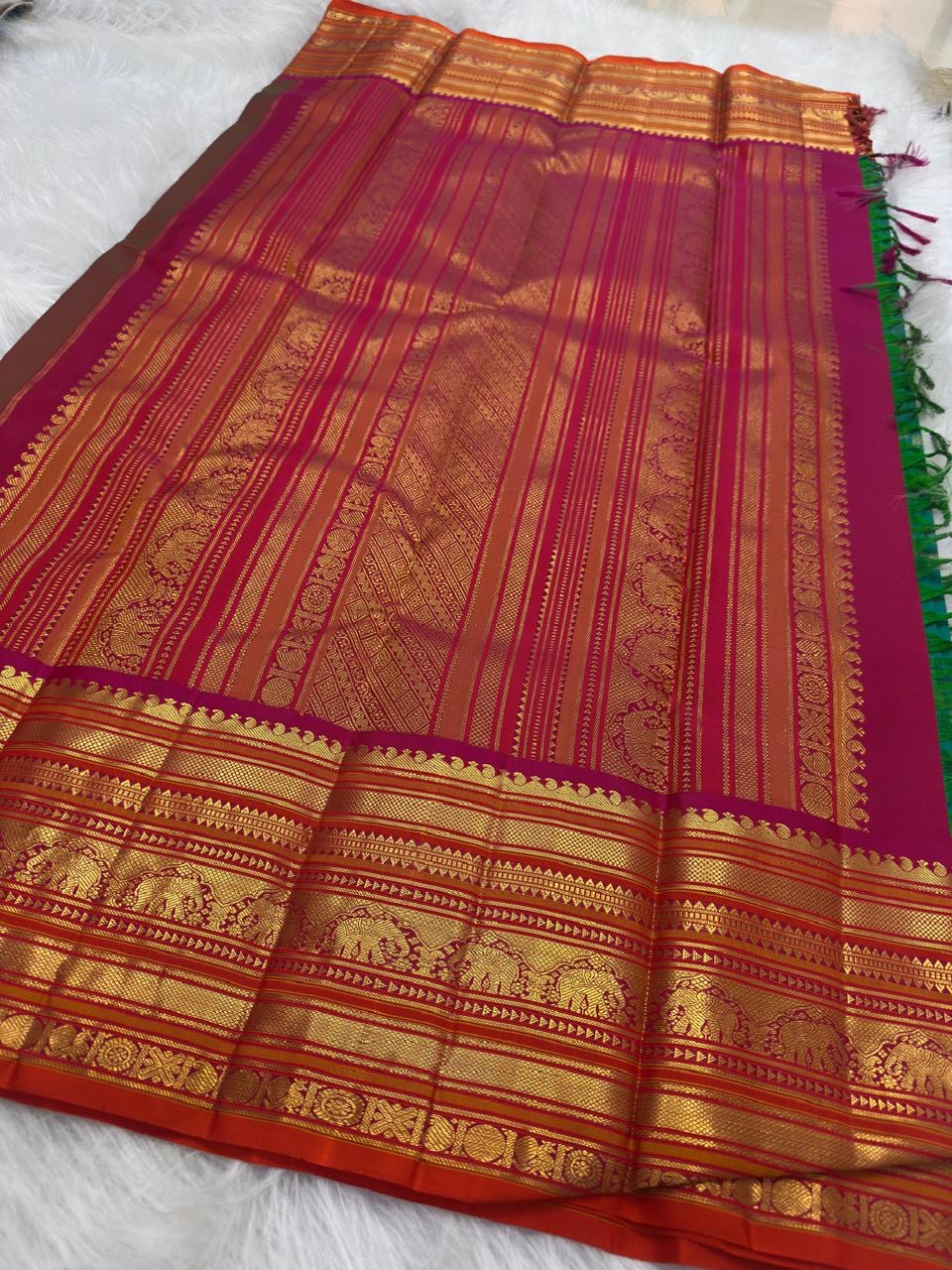 Varisaipet elephant zari border close-up on Peacock Teal KanchiPattu silk saree