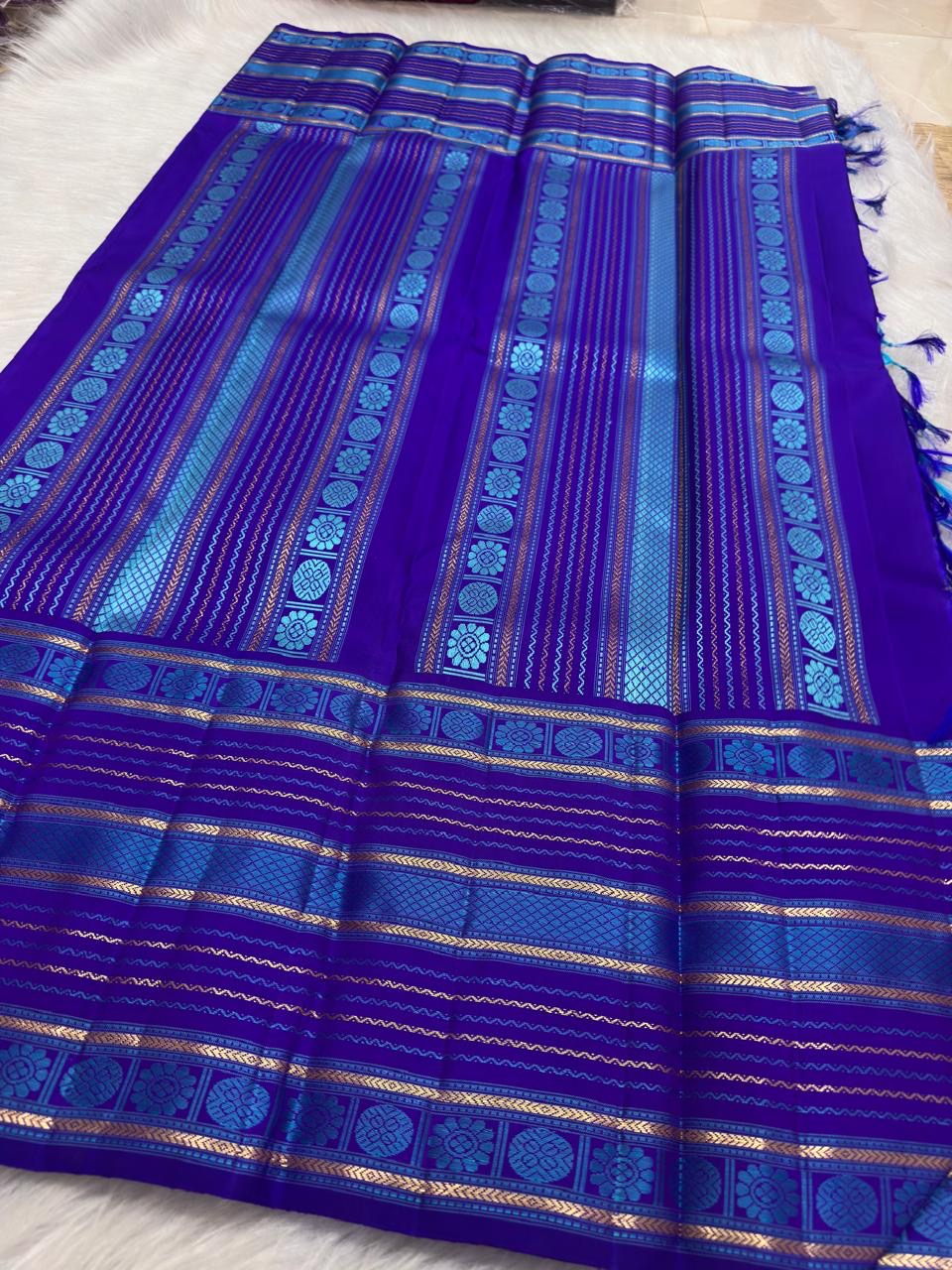 Turquoise Blue pure silk Kanchi Pattu saree, Varisaipet weave with Royal Purple border — folded view