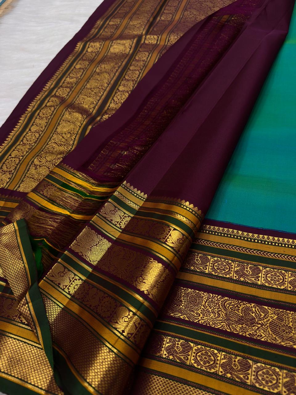 Peacock Blue-Green Handwoven Pure Silk Kanjipuram Varisaipet Saree with Petite Buttas and Multi-Motif Zari Border