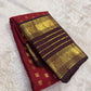 Authentic Kancheepuram silk saree featuring deep wine red and earthy coffee brown heirloom palette