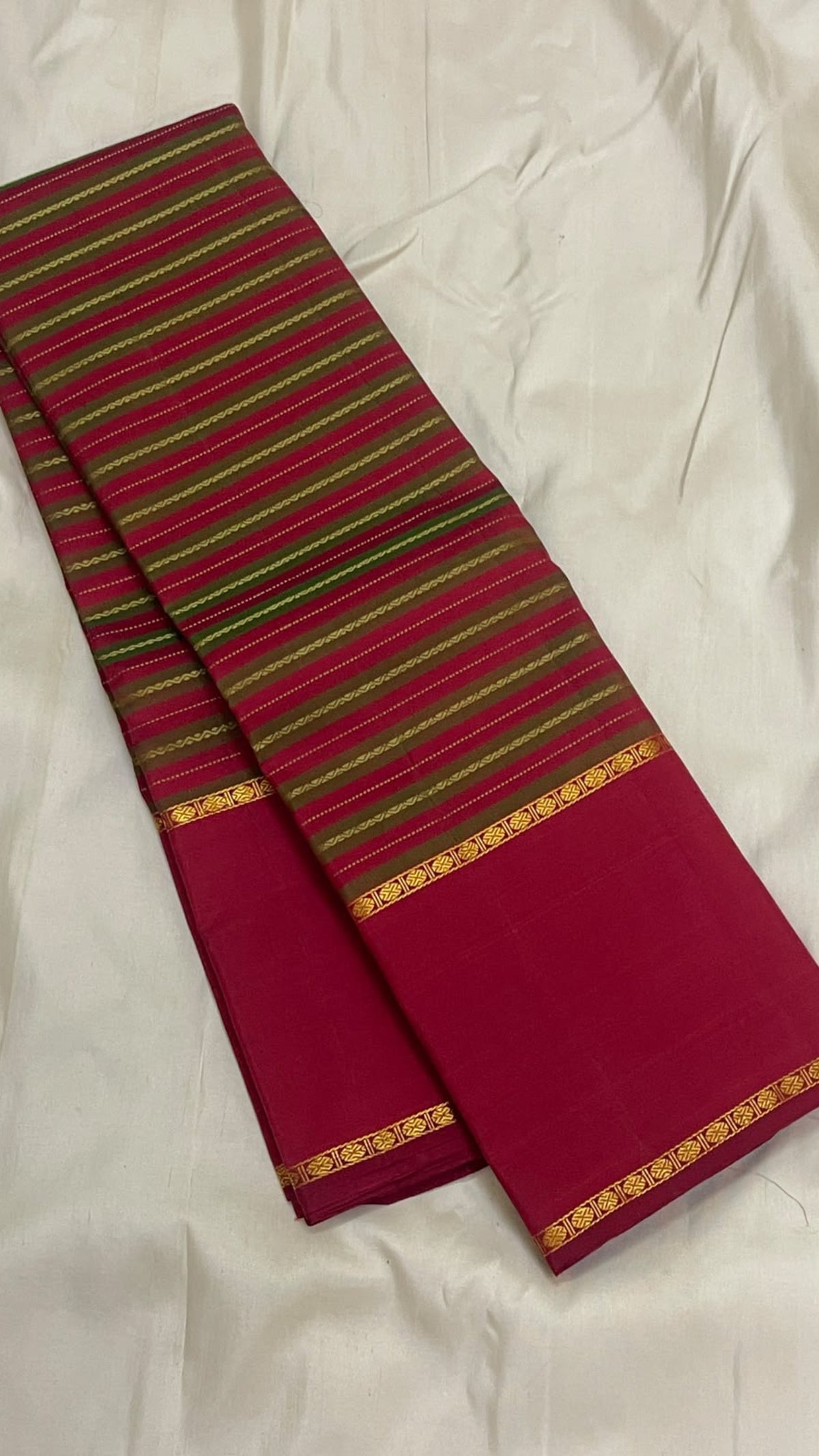 Vazhaipoo stripes in antique olive green and reddish pink with fine antique-gold zari lines on a vintage Kanjivaram silk saree