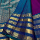 Fine vertical zari stripes across a Vadamalli magenta Kanchipuram silk saree body