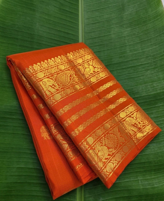 burnt orange Kanchipuram silk saree with vb weave folded view