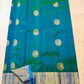 Peacock Blue and Green double-shade Kanchipuram silk showing large Veena-Peacock zari medallions and broad Sky Blue gold border.