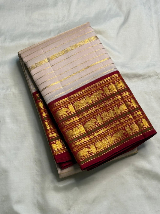 Veldhari zari stripes on a pearl pink Kanchipuram silk saree