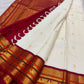Silk-thread Veldhari lines detail, warm-ivory Kanchipuram Korvai saree