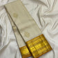 Venpattu Ivory Pure Silk Kanchipuram Butta Saree with Manjal Gold Pettu