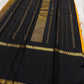 Folded view of amber Kanchi Pattu saree with Rettapet weave and black Veldhari Korvai border — Idam Living