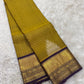 Venthaya green Kanchipuram silk saree with Zari Kattam weave and deep purple elephant border — Idam Living