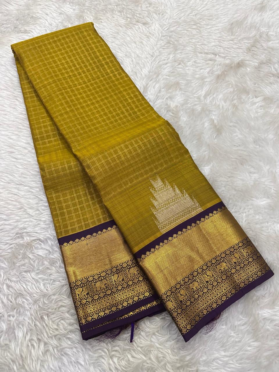 Venthaya green Kanchipuram silk saree with Zari Kattam weave and deep purple elephant border — Idam Living