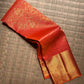 Folded view showing the dense flying horse and floral zari composition against the red silk.