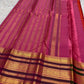 Vermilion Kanjivaram saree with fine gold zari lines.
