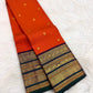 Close-up of vermilion orange pure mulberry silk body with gold zari buttas, Kanchi Pattu Varisaipet saree