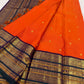 Close-up of heritage Varisaipet border with elephant and peacock zari motifs on Vermilion Orange Kanchi Pattu saree