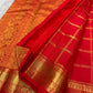 Vermilion orange handwoven pure silk KanchiPattu Zari Kattam saree with Mayil Chakram zari motifs, full view