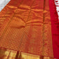Vermilion orange Kanchipuram silk saree, Zari Kattam grid close-up