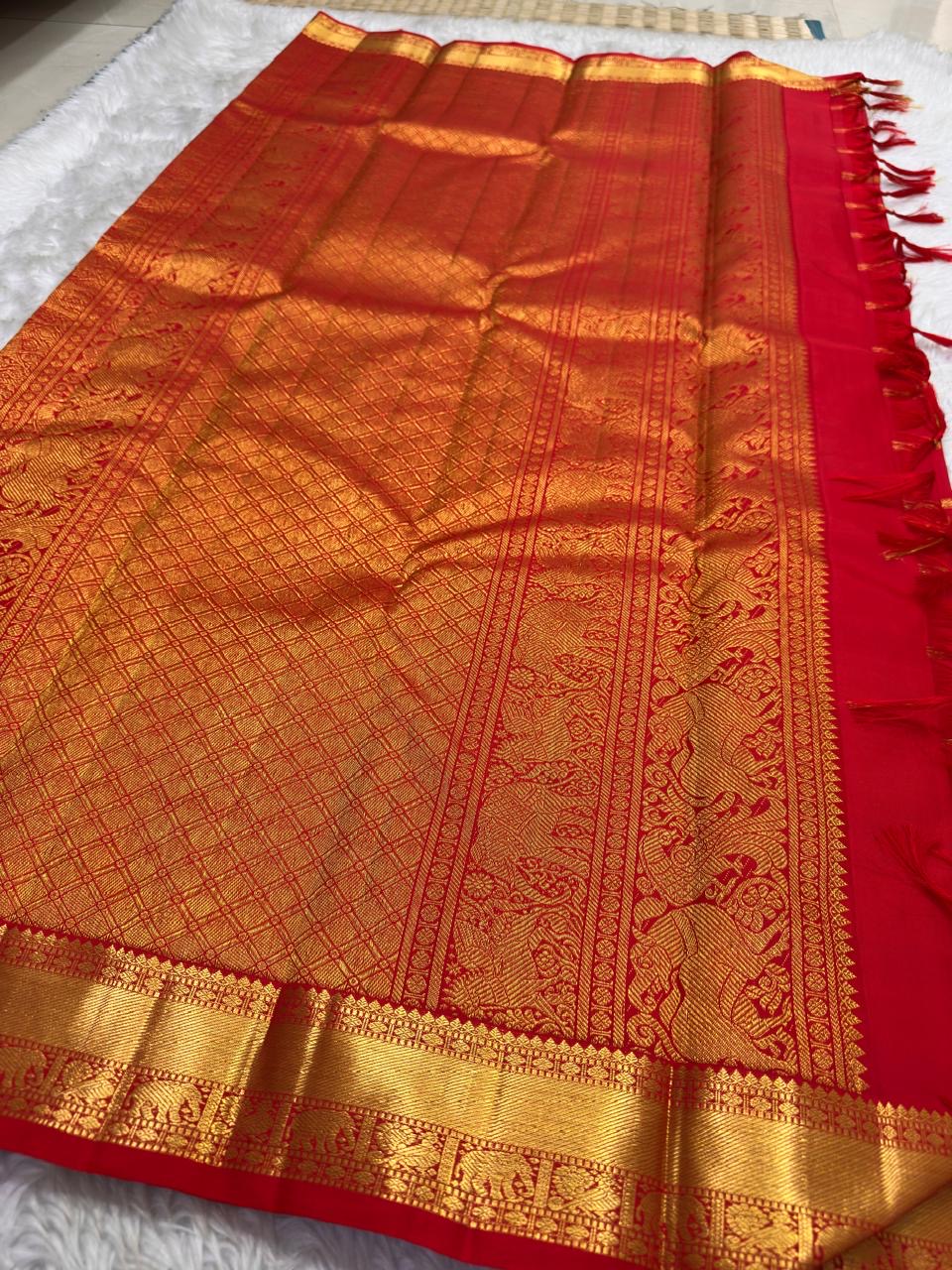 Vermilion orange Kanchipuram silk saree, Zari Kattam grid close-up