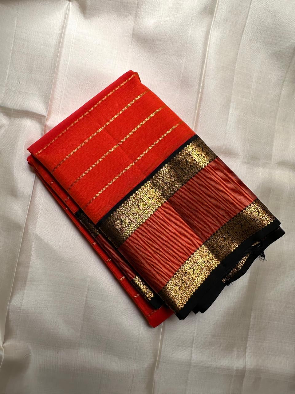 Vermilion Orange Handwoven Pure Silk KanchiPattu Saree with Rettapet Lines and Rust Manthulir Border