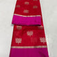Draped Vermilion Red Chanderi saree showing gold floral buttas, vivid Rani Pink border and fine striped metallic pallu.