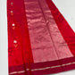 Close-up of an ivory-gold floral butta on sweet chilli red Pattu Silk Chanderi saree