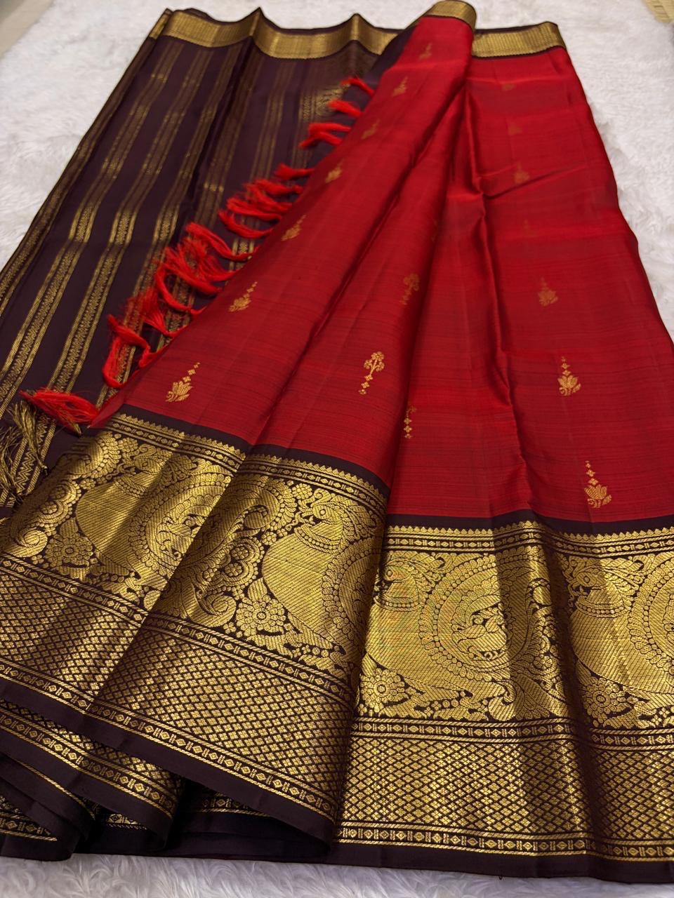 Vermilion Red Handwoven Pure Silk Kanjivaram Saree with Gold Buttas and Deep Brown Peacock Zari Border