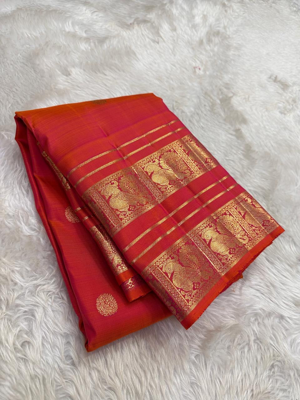 Kancheepuram silk saree in vermilion red with gold border Mayil Butta weave border detail