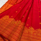 Vermilion Red KanchiPattu silk saree body close-up with gold zari floral butta motifs